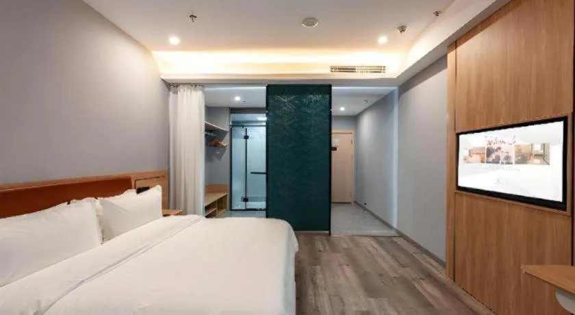 Bed in Borrman Hotel Jiangyin Zhouzhuang