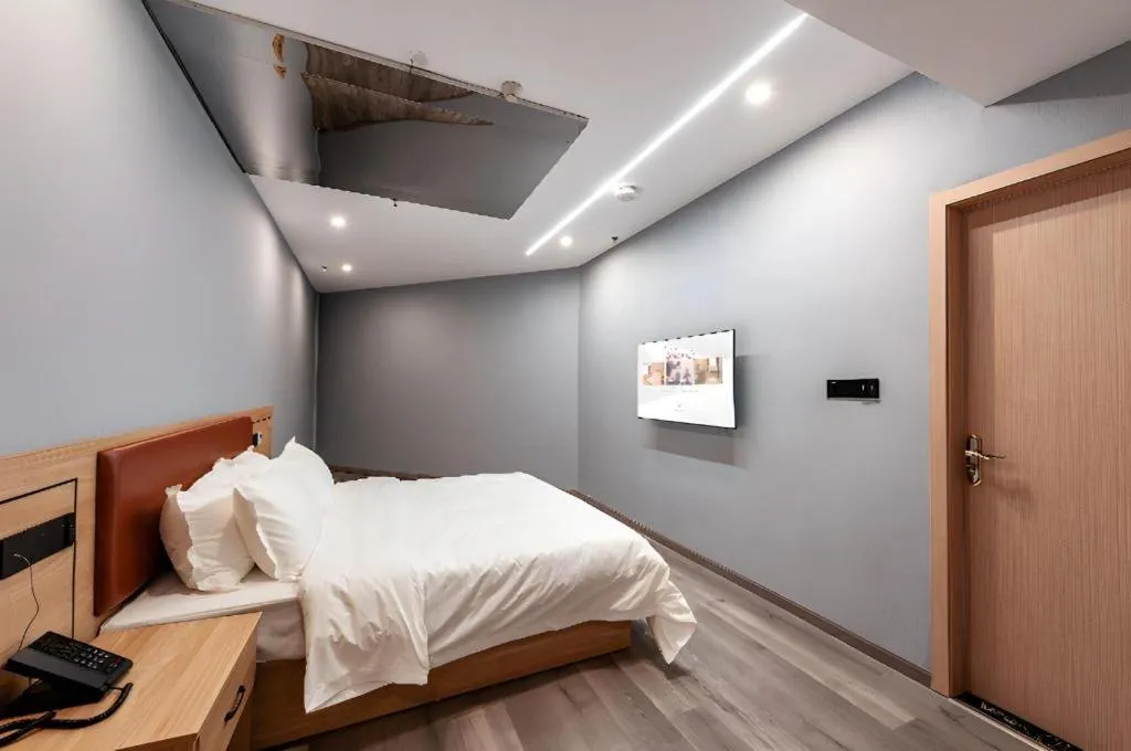 Bed in Borrman Hotel Jiangyin Zhouzhuang