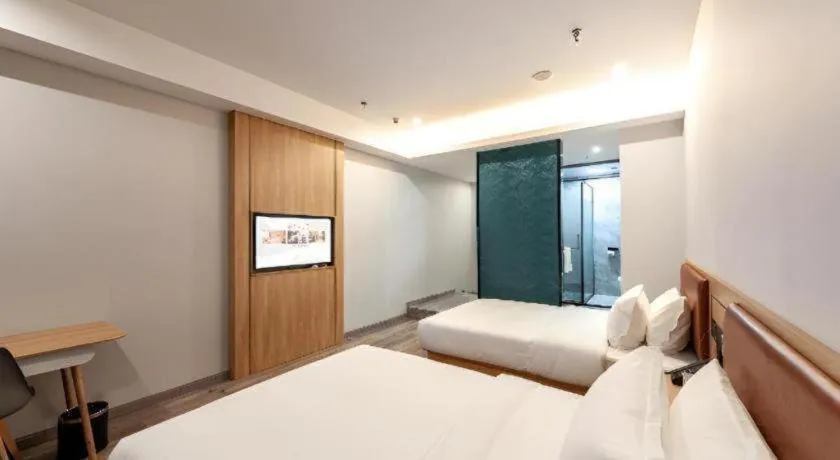 Bed in Borrman Hotel Jiangyin Zhouzhuang