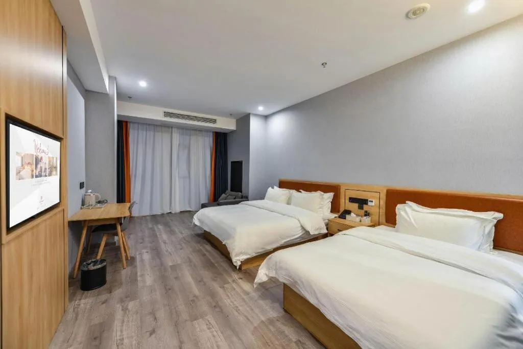 Bed in Borrman Hotel Jiangyin Zhouzhuang