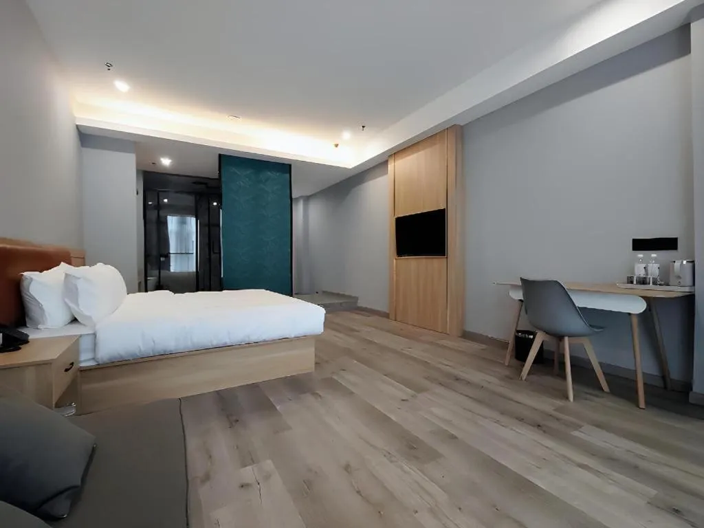 Bed in Borrman Hotel Jiangyin Zhouzhuang