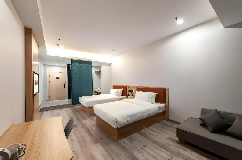 Bed in Borrman Hotel Jiangyin Zhouzhuang