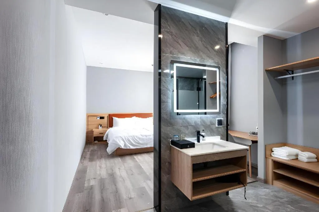 Bed in Borrman Hotel Jiangyin Zhouzhuang