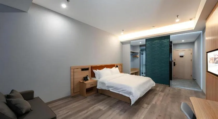 Bed in Borrman Hotel Jiangyin Zhouzhuang