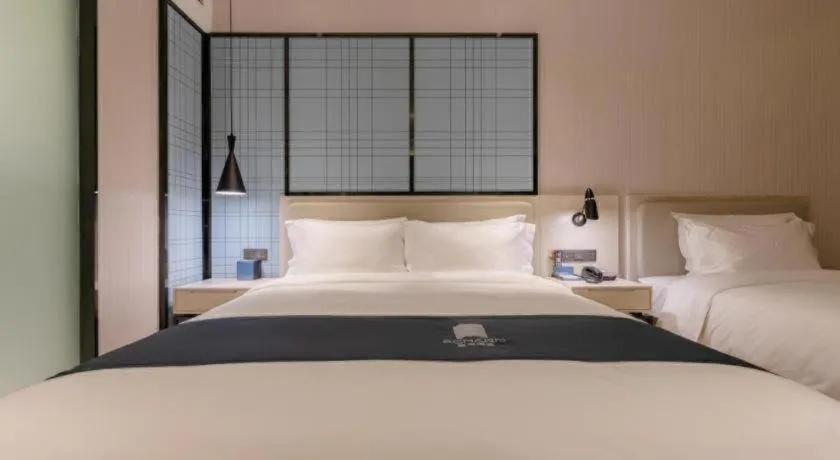 Bed in Echarm Hotel Yantai Wuzhou International