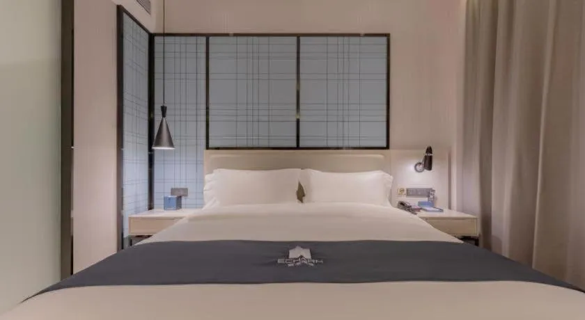 Bed in Echarm Hotel Yantai Wuzhou International