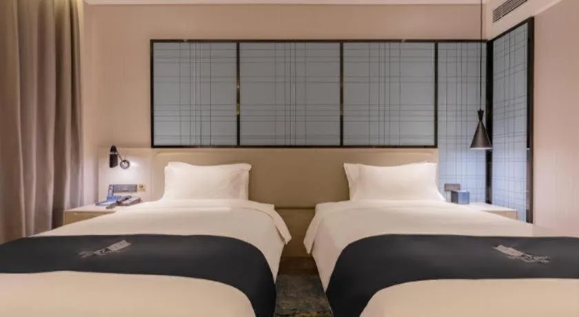 Bed in Echarm Hotel Yantai Wuzhou International