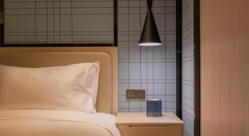 Bed in Echarm Hotel Yantai Wuzhou International