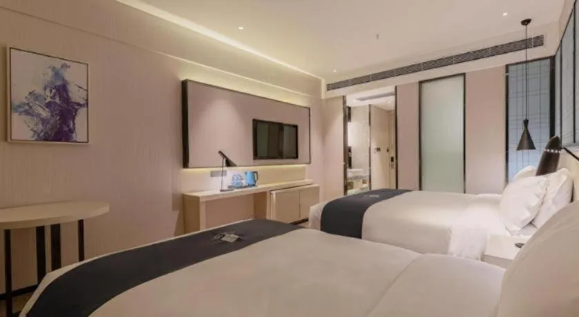 Bed in Echarm Hotel Yantai Wuzhou International