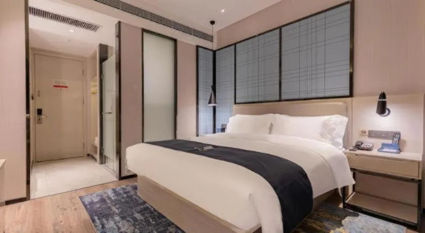 Bed in Echarm Hotel Yantai Wuzhou International