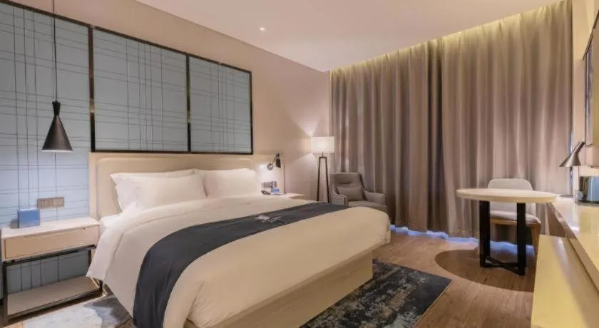 Bed in Echarm Hotel Yantai Wuzhou International