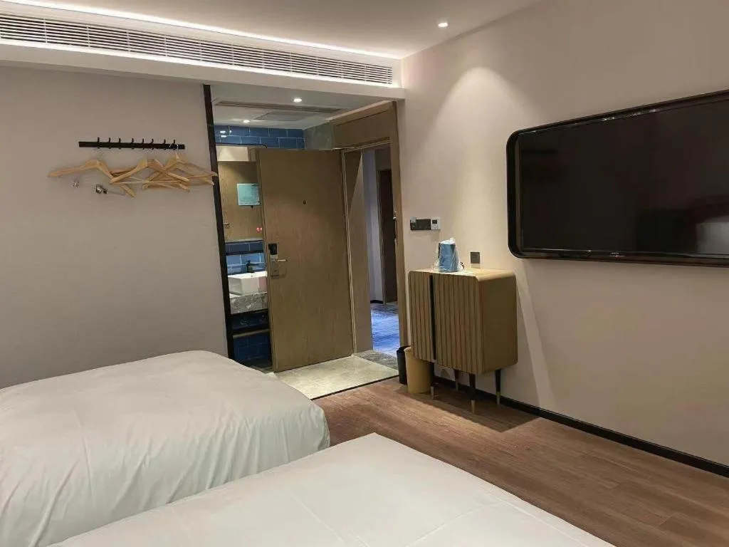 Bed in Echarm Hotel Nanjing Expo Center Olympic East Metro Station