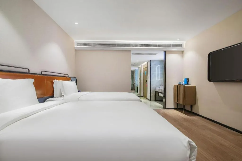 Bed in Echarm Hotel Nanjing Expo Center Olympic East Metro Station