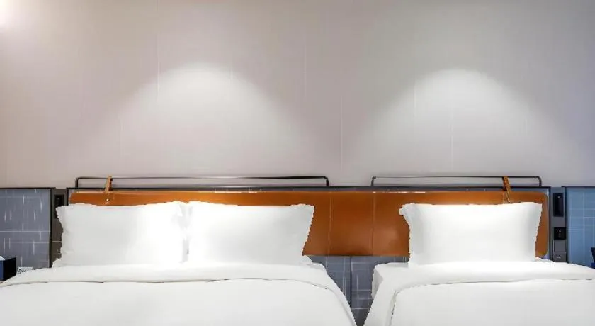 Bed in Echarm Hotel Nanjing Expo Center Olympic East Metro Station