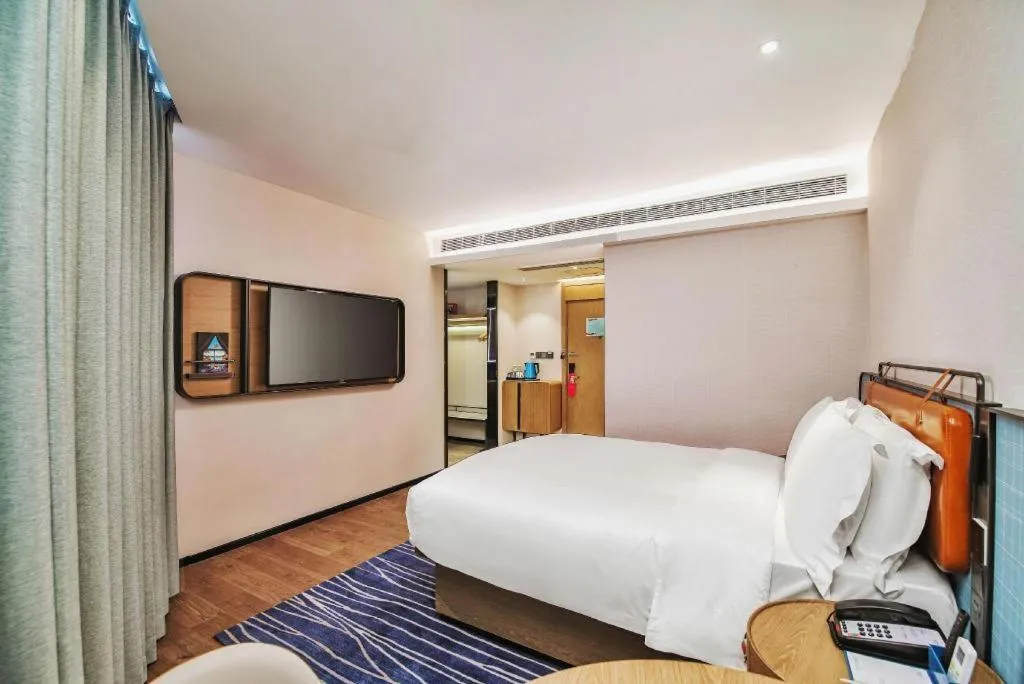 Bed in Echarm Hotel Nanjing Expo Center Olympic East Metro Station