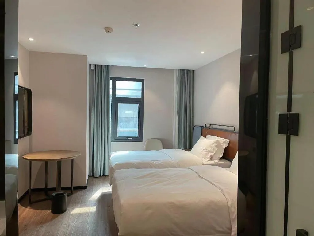 Bed in Echarm Hotel Nanjing Expo Center Olympic East Metro Station