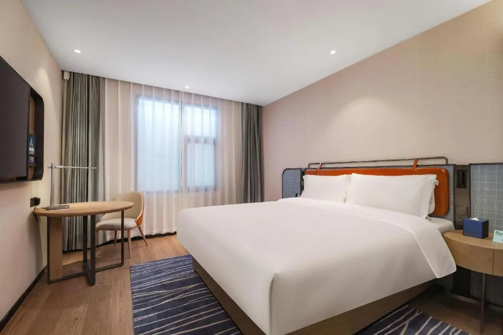 Bed in Echarm Hotel Nanjing Expo Center Olympic East Metro Station