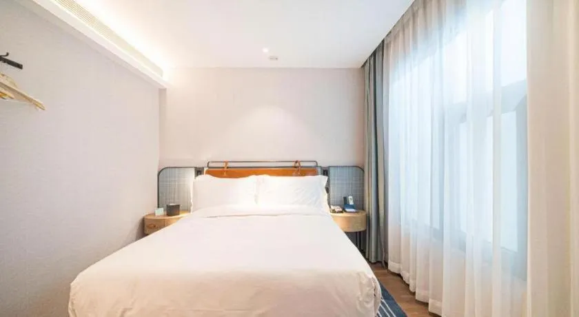 Bed in Echarm Hotel Nanjing Expo Center Olympic East Metro Station