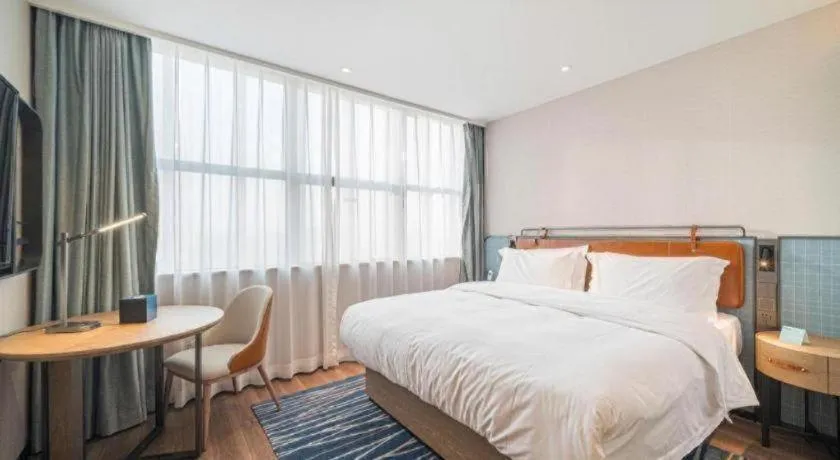 Bed in Echarm Hotel Nanjing Expo Center Olympic East Metro Station