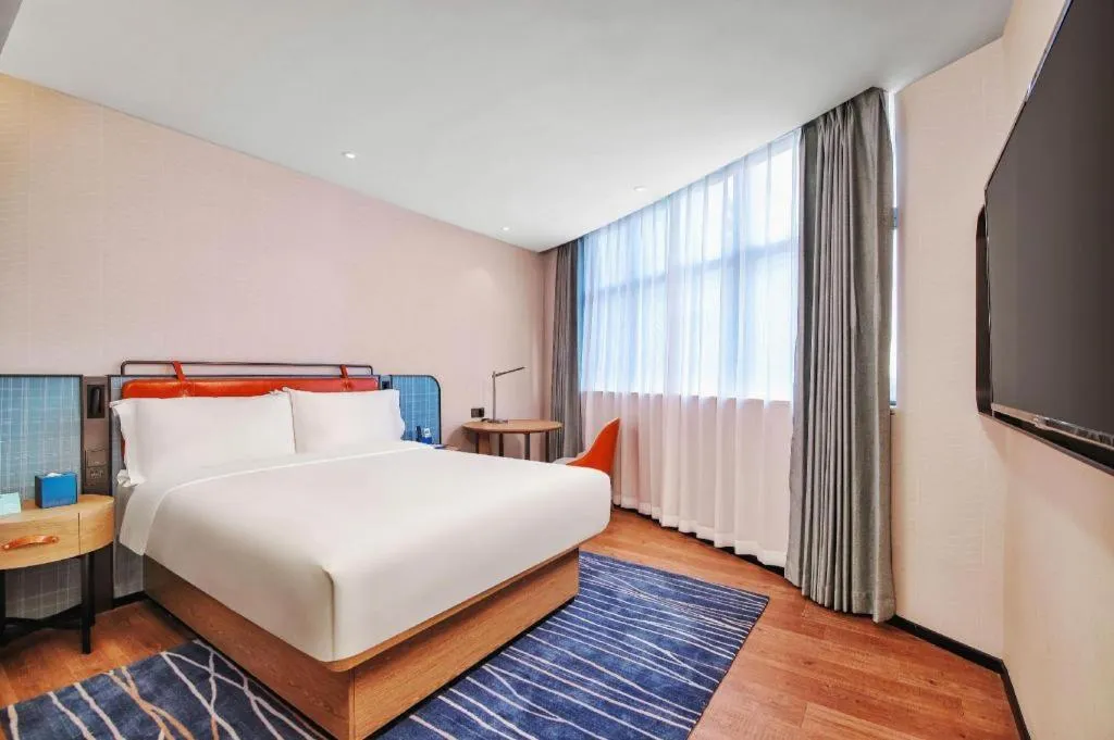 Bed in Echarm Hotel Nanjing Expo Center Olympic East Metro Station