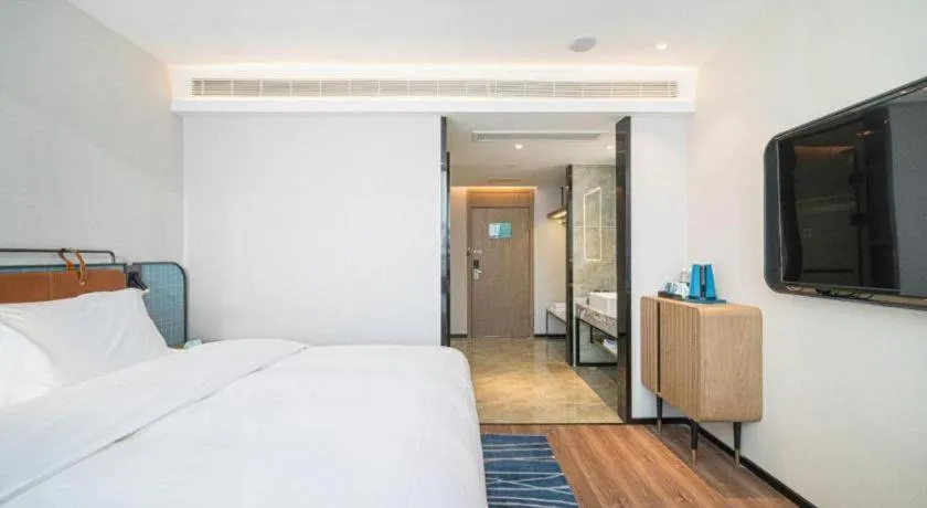 Bed in Echarm Hotel Nanjing Expo Center Olympic East Metro Station