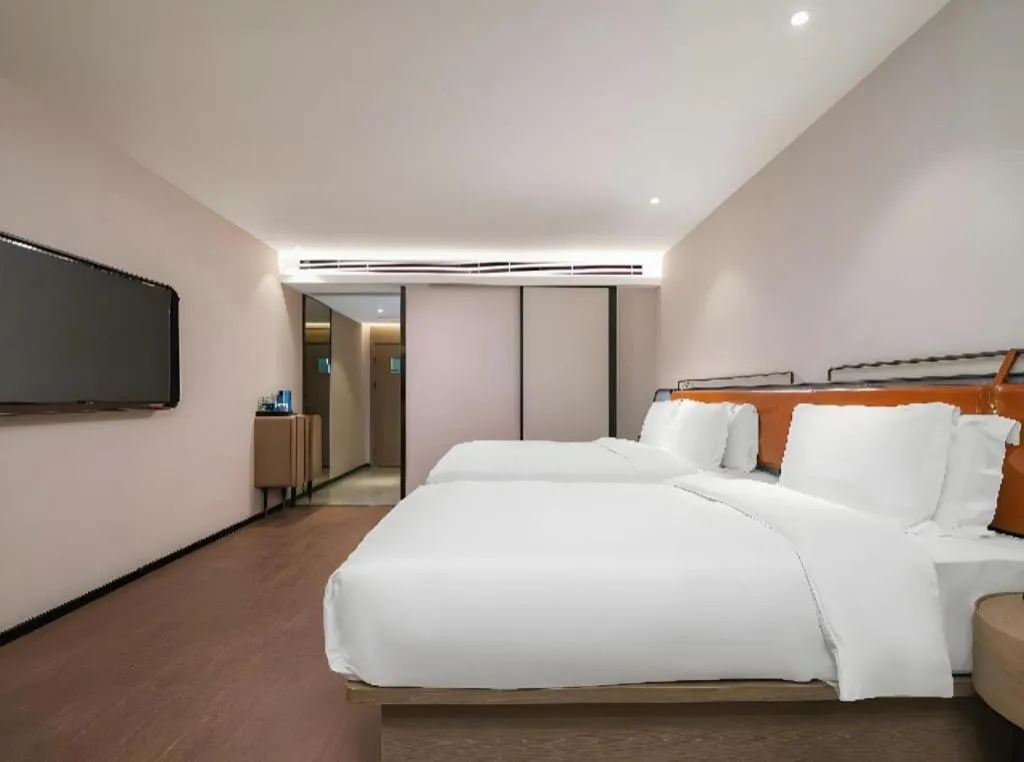 Bed in Echarm Hotel Nanjing Expo Center Olympic East Metro Station