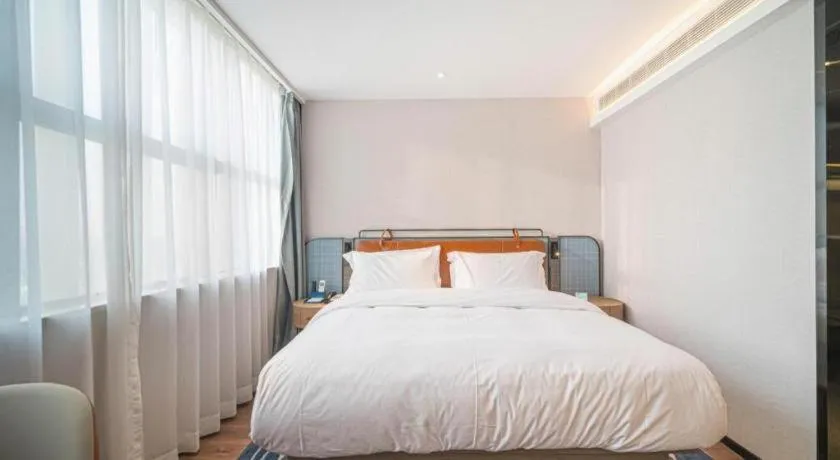 Bed in Echarm Hotel Nanjing Expo Center Olympic East Metro Station