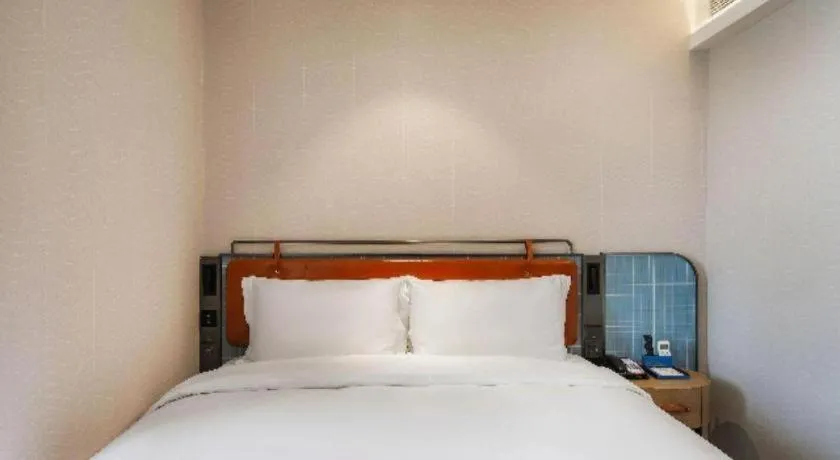 Bed in Echarm Hotel Nanjing Expo Center Olympic East Metro Station