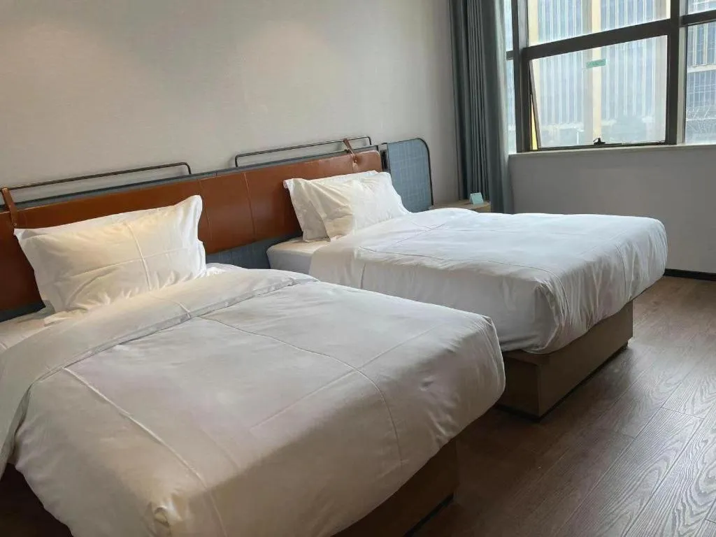 Bed in Echarm Hotel Nanjing Expo Center Olympic East Metro Station