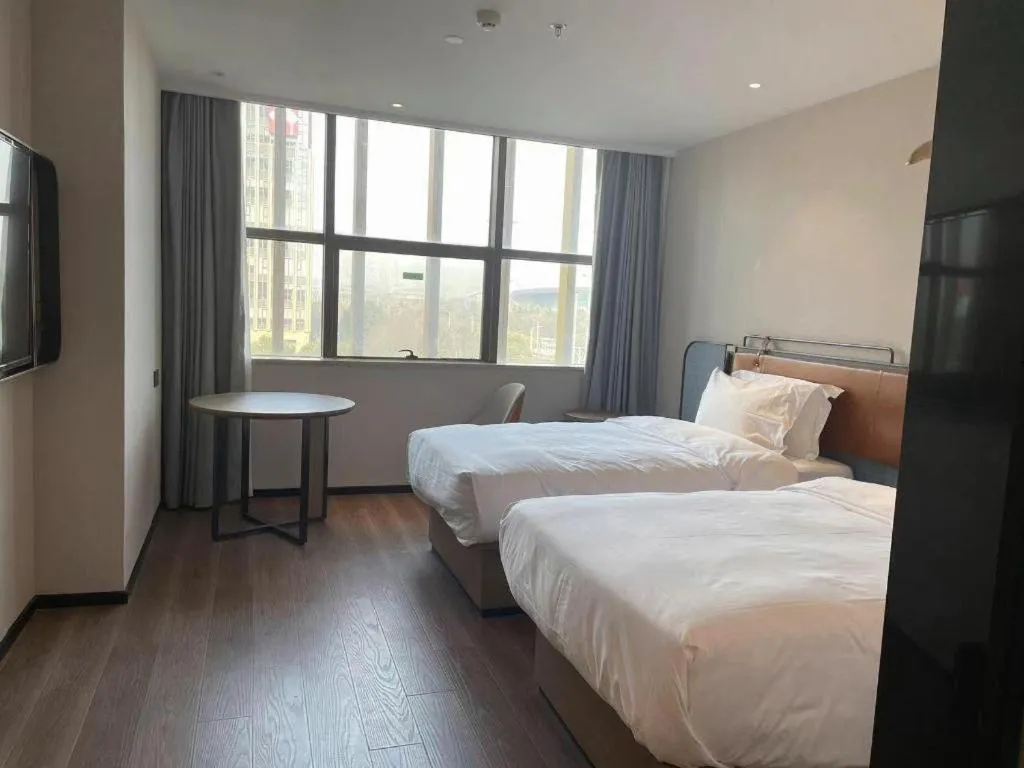 Bed in Echarm Hotel Nanjing Expo Center Olympic East Metro Station