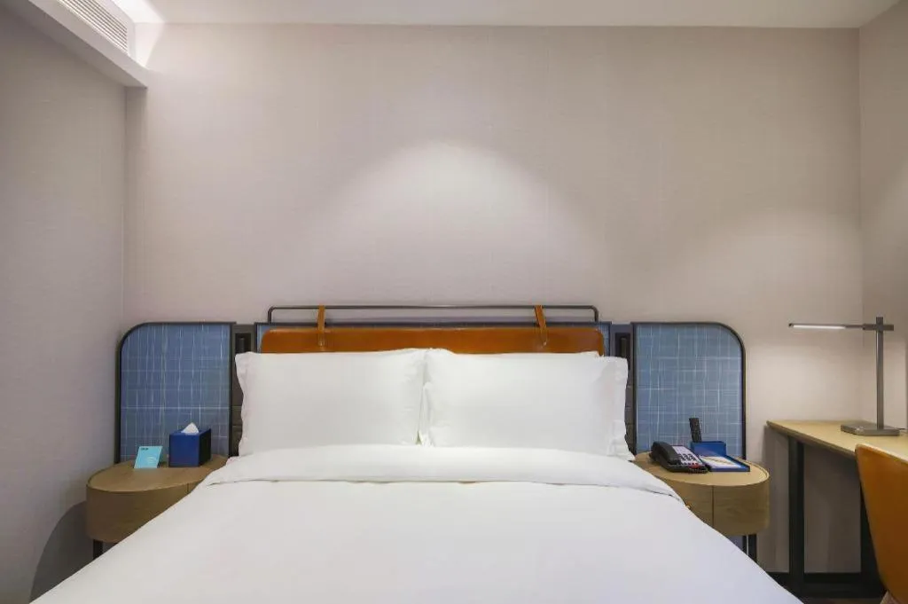 Bed in Echarm Hotel Nanjing Expo Center Olympic East Metro Station