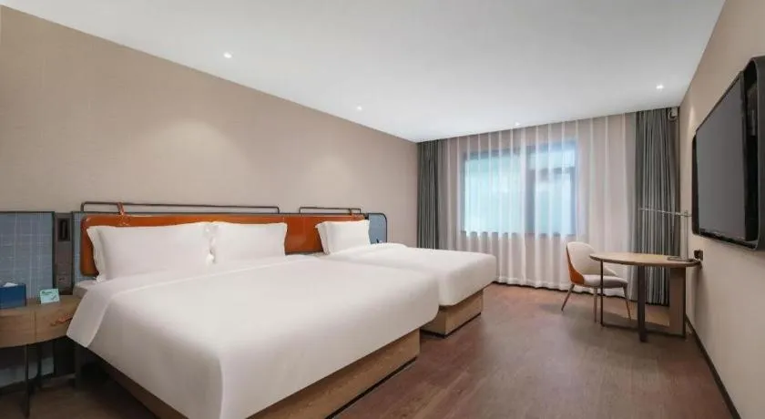 Bed in Echarm Hotel Nanjing Expo Center Olympic East Metro Station