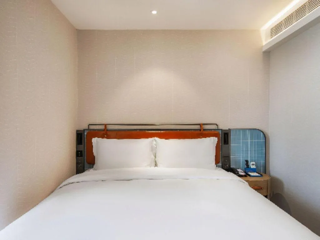 Bed in Echarm Hotel Nanjing Expo Center Olympic East Metro Station