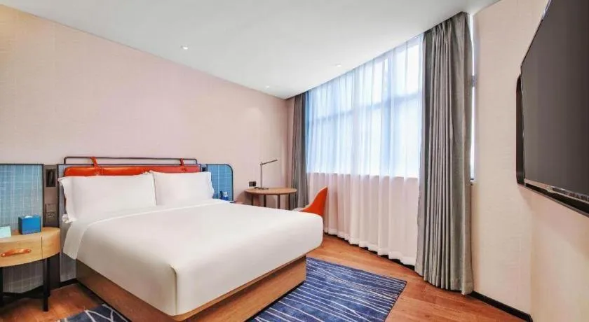 Bed in Echarm Hotel Nanjing Expo Center Olympic East Metro Station