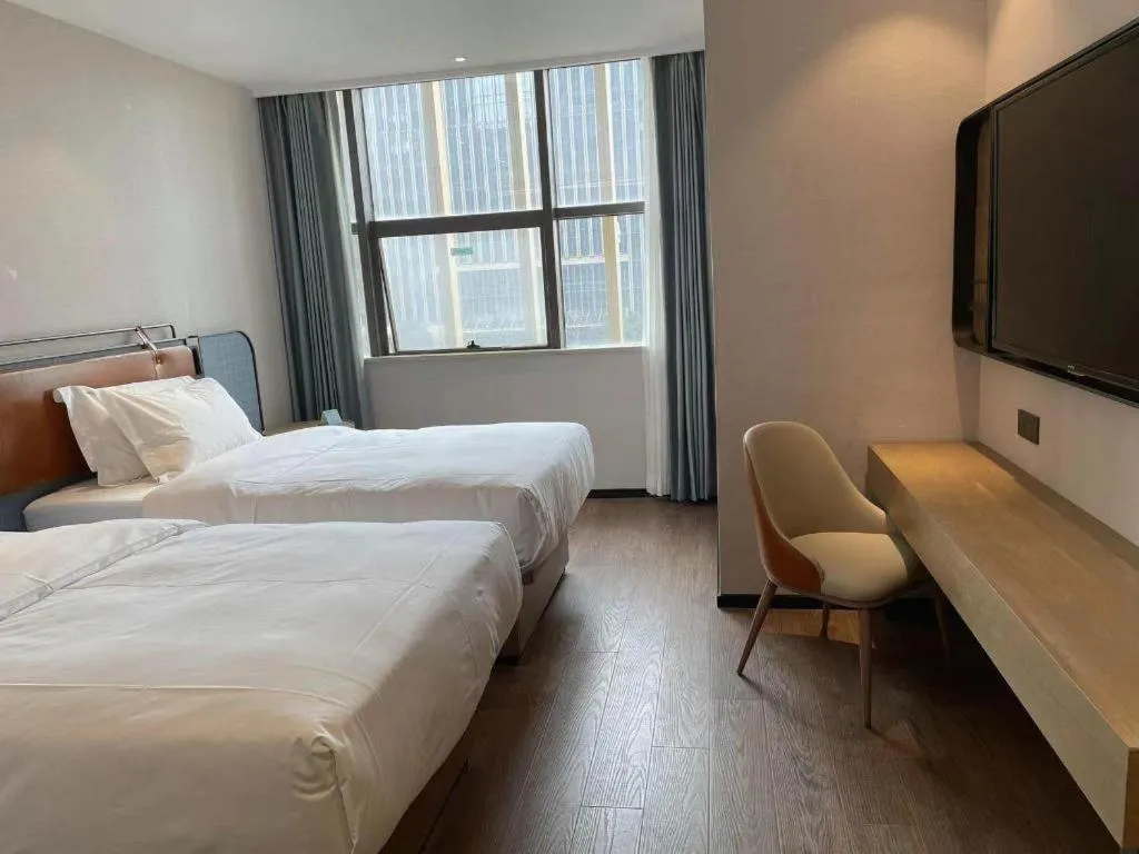 Bed in Echarm Hotel Nanjing Expo Center Olympic East Metro Station