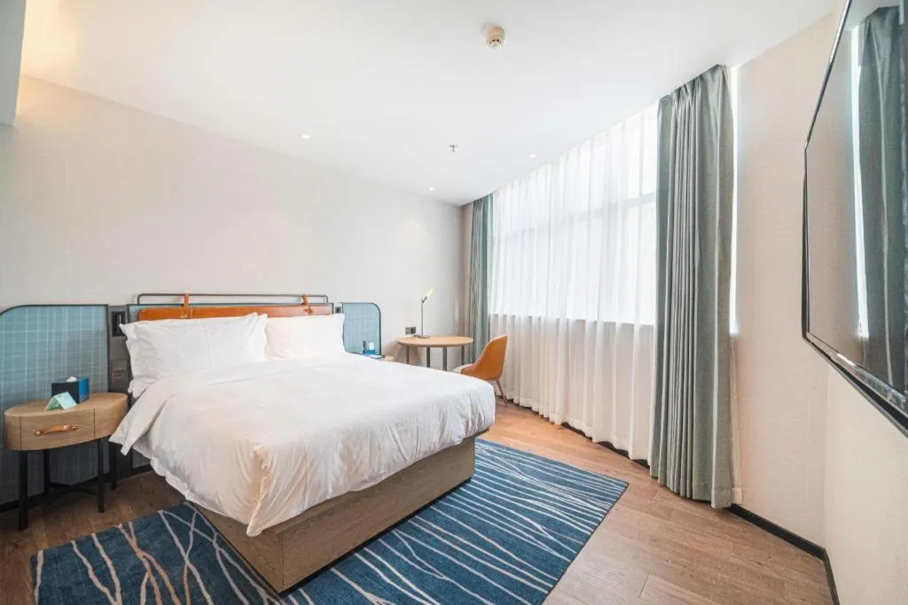 Bed in Echarm Hotel Nanjing Expo Center Olympic East Metro Station