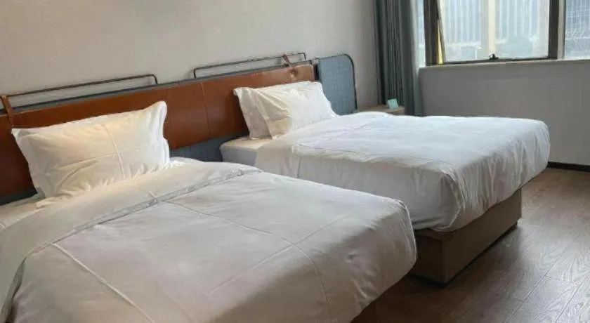 Bed in Echarm Hotel Nanjing Expo Center Olympic East Metro Station