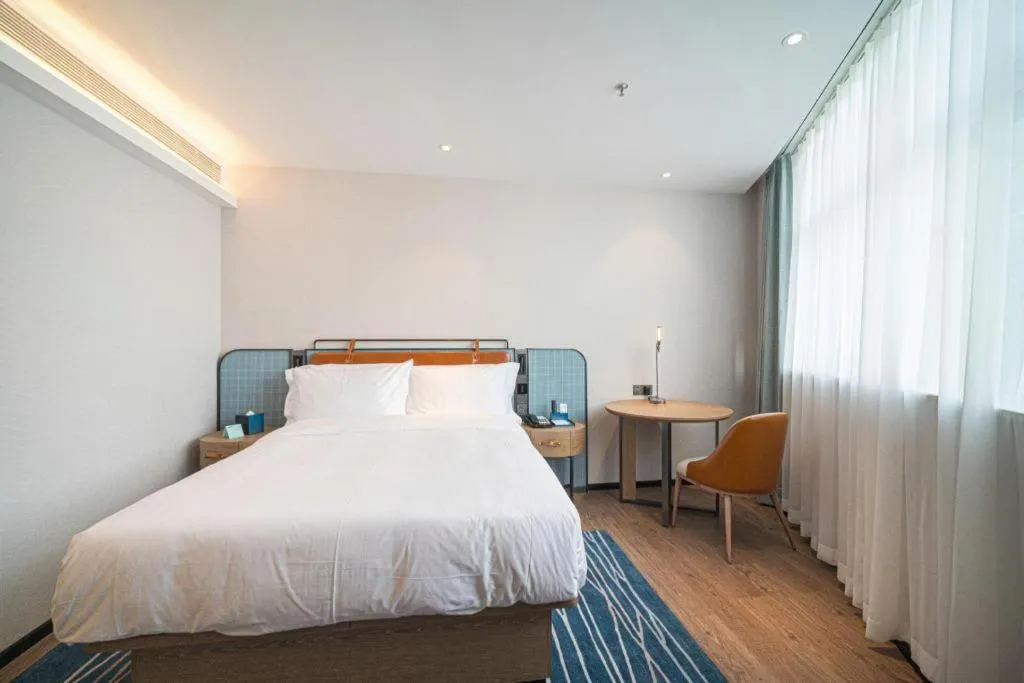 Bed in Echarm Hotel Nanjing Expo Center Olympic East Metro Station