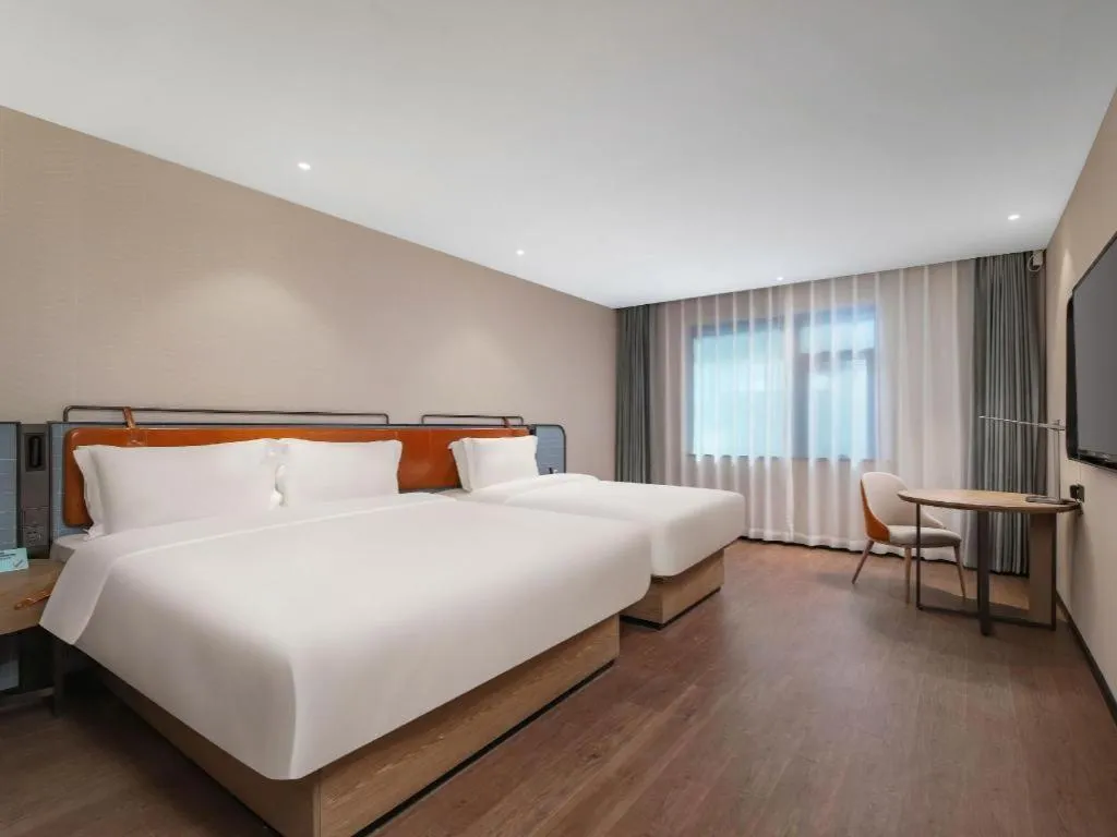 Bed in Echarm Hotel Nanjing Expo Center Olympic East Metro Station