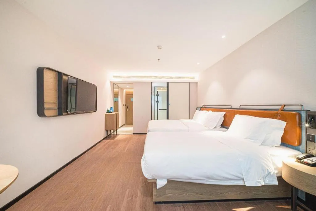 Bed in Echarm Hotel Nanjing Expo Center Olympic East Metro Station