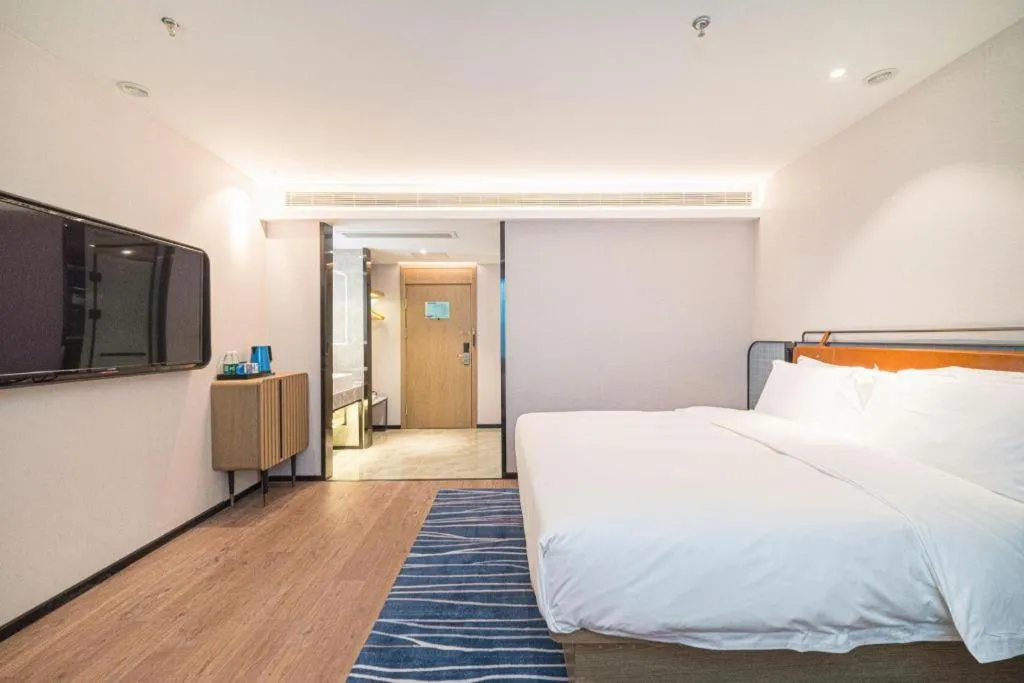 Bed in Echarm Hotel Nanjing Expo Center Olympic East Metro Station