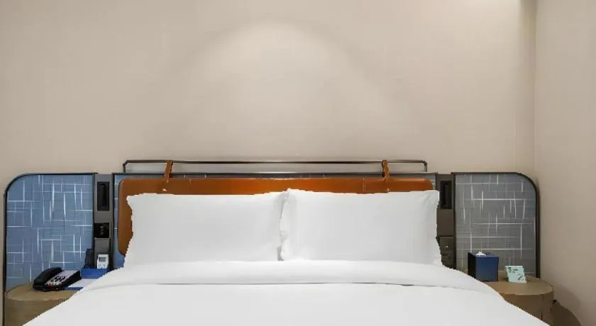 Bed in Echarm Hotel Nanjing Expo Center Olympic East Metro Station