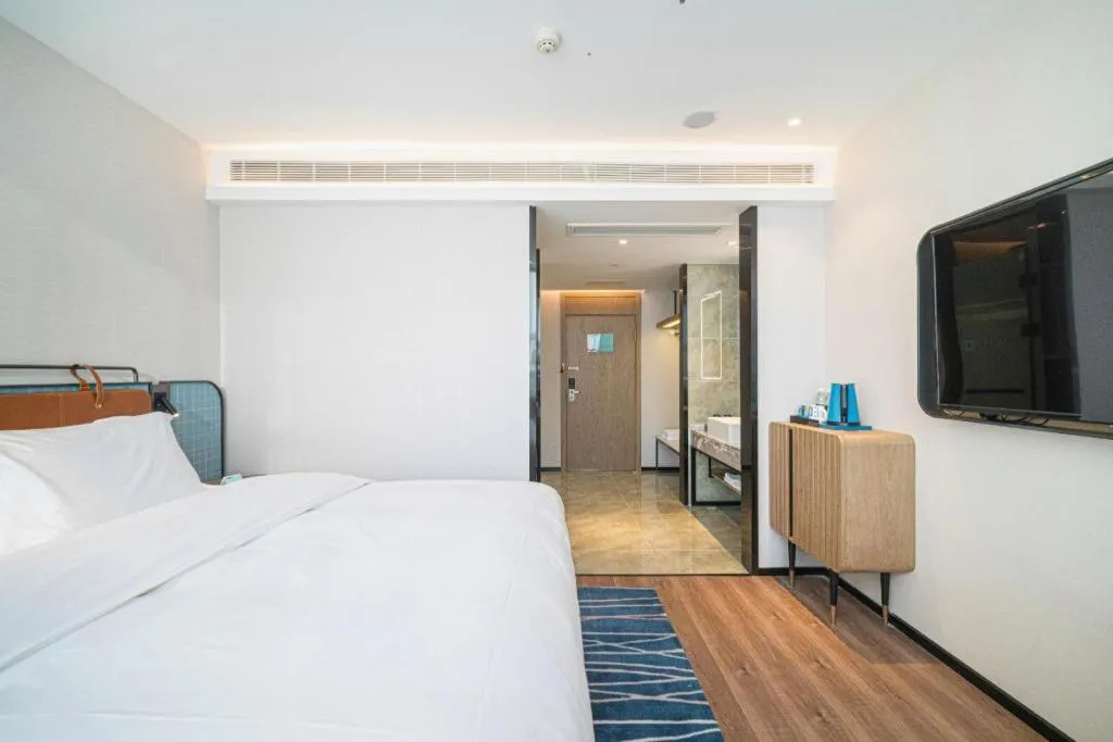 Bed in Echarm Hotel Nanjing Expo Center Olympic East Metro Station