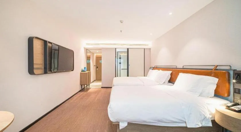 Bed in Echarm Hotel Nanjing Expo Center Olympic East Metro Station