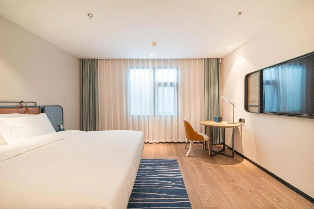 Bed in Echarm Hotel Nanjing Expo Center Olympic East Metro Station