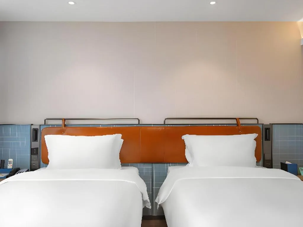 Bed in Echarm Hotel Nanjing Expo Center Olympic East Metro Station