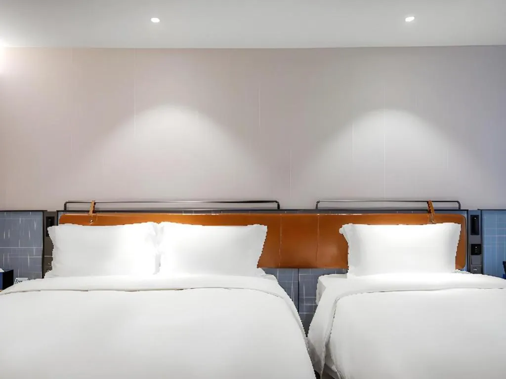 Bed in Echarm Hotel Nanjing Expo Center Olympic East Metro Station