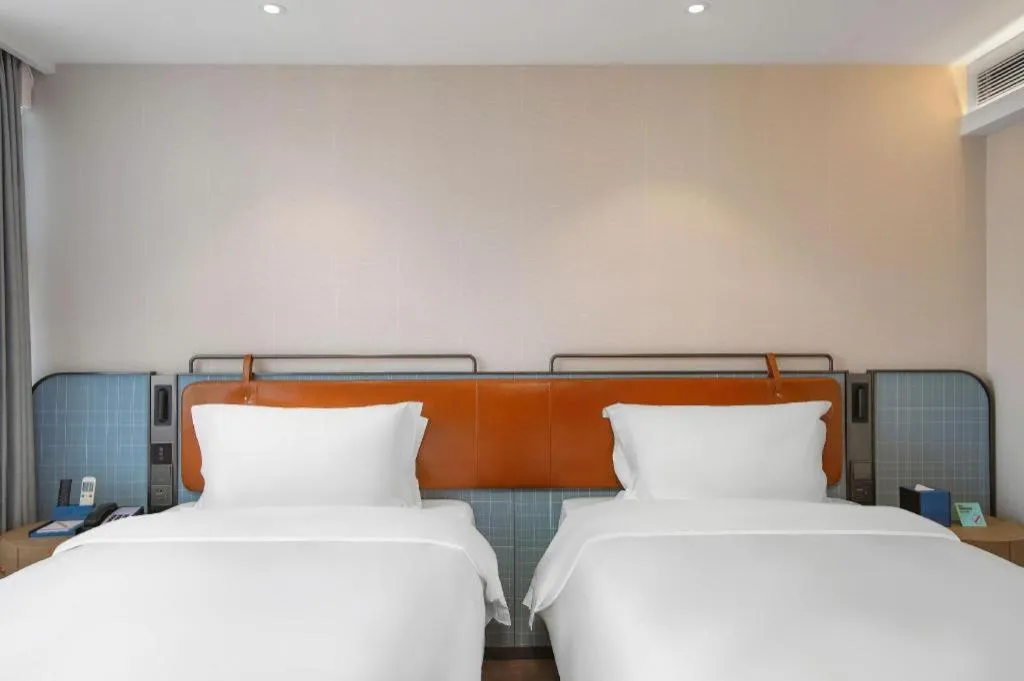 Bed in Echarm Hotel Nanjing Expo Center Olympic East Metro Station