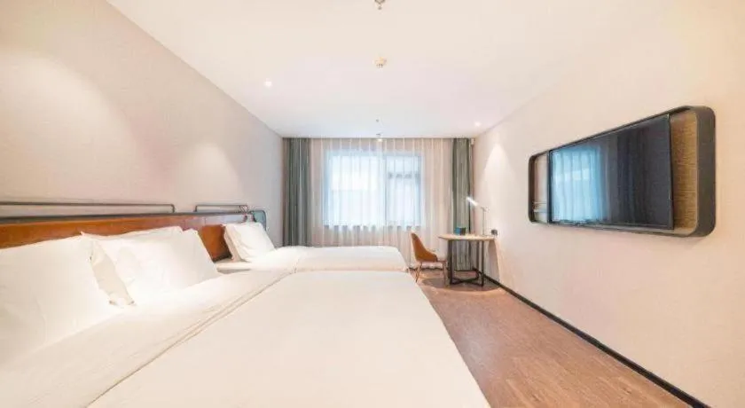 Bed in Echarm Hotel Nanjing Expo Center Olympic East Metro Station