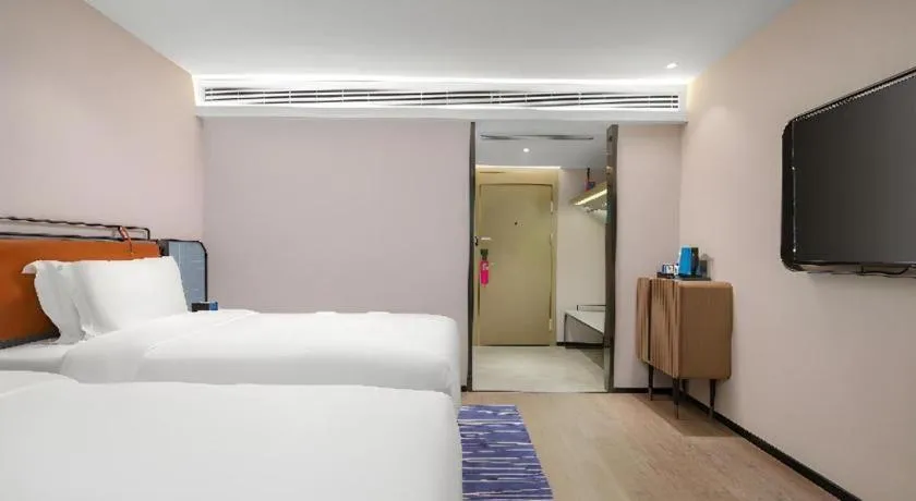 Bed in Echarm Hotel Nanjing Expo Center Olympic East Metro Station